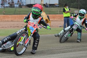 Motorcycle Action At Speedway